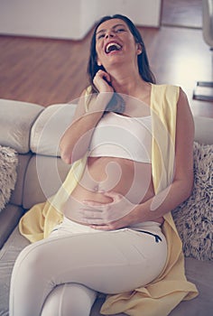 Pregnant woman at home.