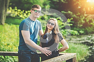 pregnant woman and husband in nature park