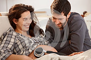 Pregnant woman and husband relaxing