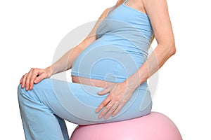 The pregnant woman on an inflatable ball