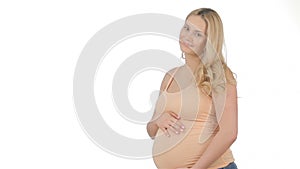 Pregnant woman keeps her hands on her belly