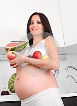 Pregnant woman in kitchen