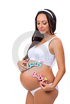 Pregnant woman with label Baby. Determination of sex of the child. Newborn girl, boy or twins