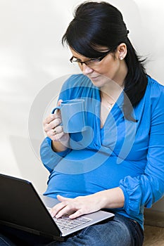 Pregnant woman and laptop