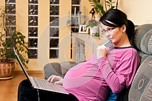 Pregnant woman with laptop