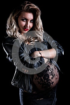 Pregnant woman in a leather jacket