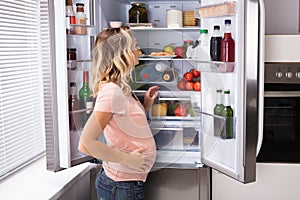 Pregnant Woman Looking For Food