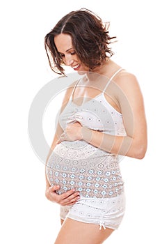 Pregnant woman looking on her belly