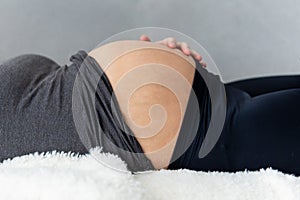 Pregnant woman lying on her back and resting
