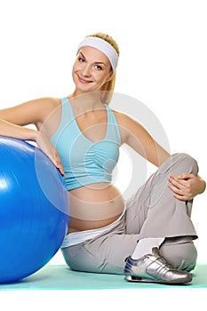 Pregnant woman making exercise