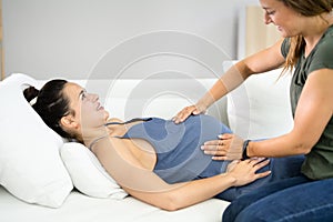 Pregnant Woman Massage By Doula. Baby Care