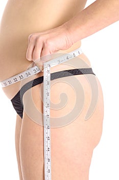 Pregnant woman measuring belly upclose