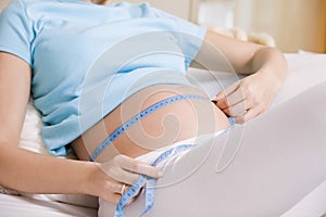 Pregnant Woman Measuring Stomach