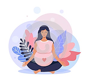 Pregnant woman meditating while sitting in lotus pose.