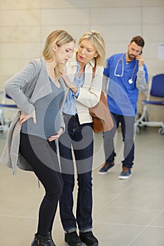 pregnant woman with mother in clinic