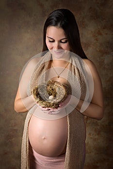 Pregnant woman with nest