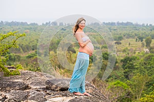 Pregnant woman outdoors