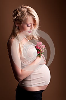 Pregnant woman in a photo studio