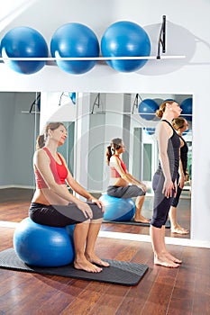 Pregnant woman pilates exercise fitball photo