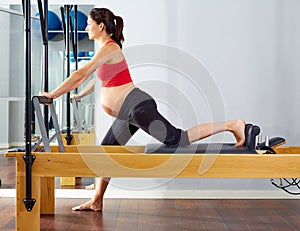 Pregnant woman pilates reformer cadillac exercise