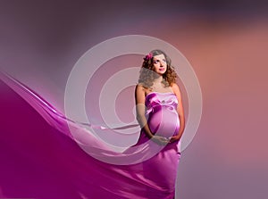 Pregnant woman in pink fabric