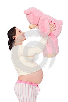 Pregnant woman with pink teddy bear