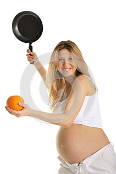 Pregnant woman playing tennis orange and pan