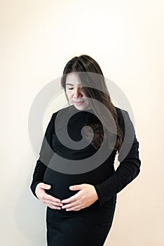 Pregnant woman : Pregnant happy Woman touching her belly. Pregnant middle aged mother portrait