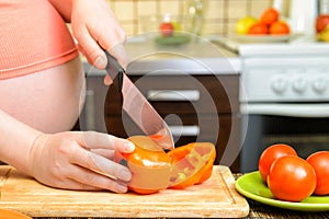 Pregnant woman preparing a healthy meal