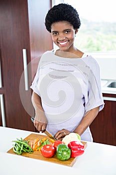 Pregnant woman preparing vegetables