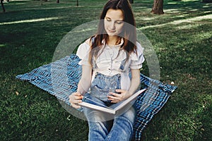 Pregnant woman reading a book to her unborn baby