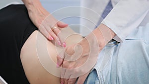 Pregnant woman receiving a routine check-up from a healthcare professional