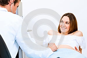 Pregnant woman on reception at the doctor