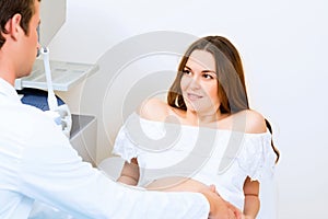 Pregnant woman on reception at the doctor