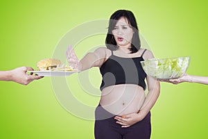 Pregnant woman reject junk food