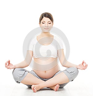 Pregnant woman relax doing yoga, sitting in lotus position