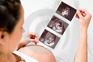 Pregnant woman reviewing baby ultrasound scan