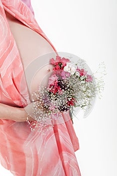 Pregnant woman's belly with flowers