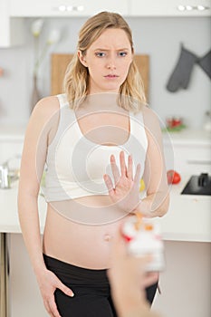 pregnant woman saying no to cigarettes