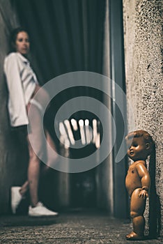 Pregnant woman and scary doll