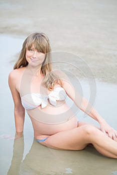 Pregnant woman on a seashore