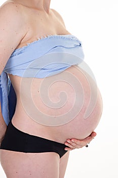 Pregnant woman side view belly in pregnancy concept