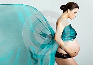 Pregnant woman with silk