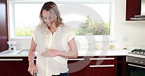 Pregnant woman slicing vegetables