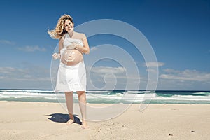 Pregnant woman with a smile on the belly