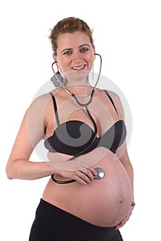Pregnant woman with stetoscope photo