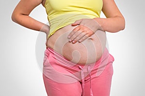 Pregnant woman with stomach ache - heartburn concept