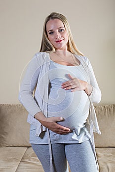 Pregnant woman stroking her belly