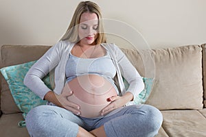 Pregnant woman stroking her belly