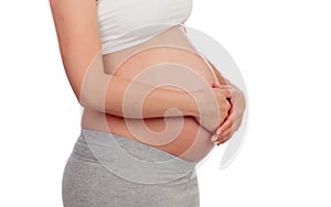 Pregnant woman stroking her belly i